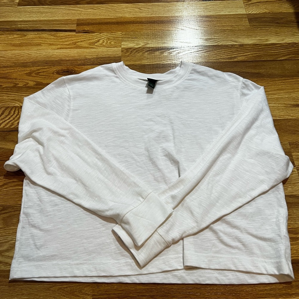 Medium white long sleeve shirt, kind of see through
